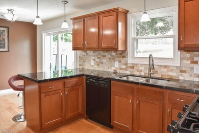 Updated kitchen with new cabinets and tile backspl
