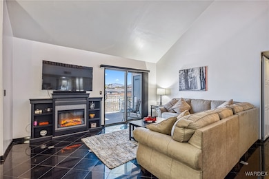 Living room with high vaulted ceiling