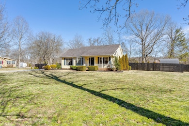 Very nice covered front porch with lots of front yard space.