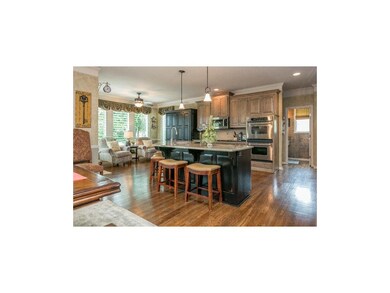 Open kitchen and hearth flows directly to the grea