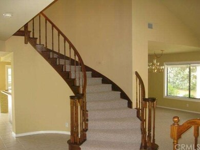 Gracious curved staircase, visible as you enter th