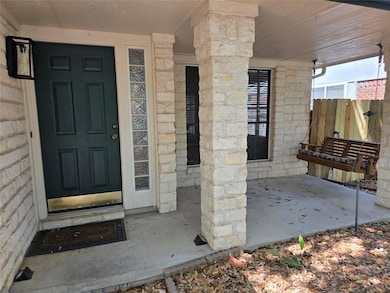 View of exterior entry with stone siding