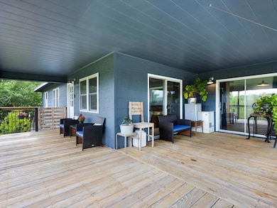 Wooden deck featuring an outdoor living space