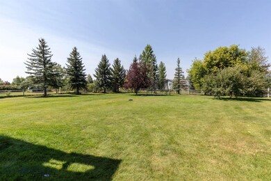 Gorgeous half acre with landscaped backyard, under
