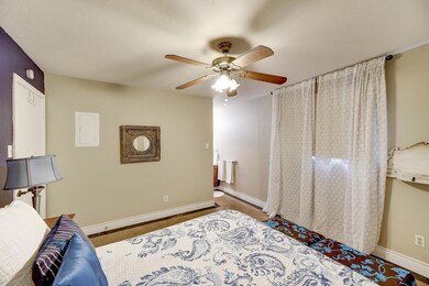 Bedroom featuring baseboards and ceiling fan