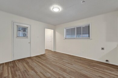 Unfurnished room with light hardwood / wood-style 