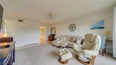 Living room featuring light tile patterned floors,