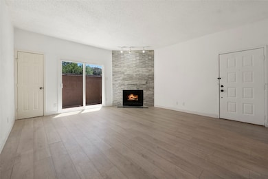 Spacious living area with a cozy fireplace, seamle