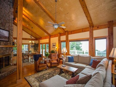 Open concept living. Floor to ceiling stone firepl