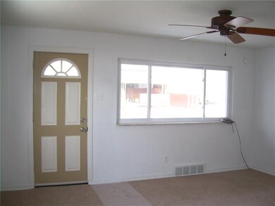 Living Room has the new taupe wall to wall carpeti