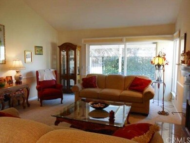 View of golf course and rear patio from living roo