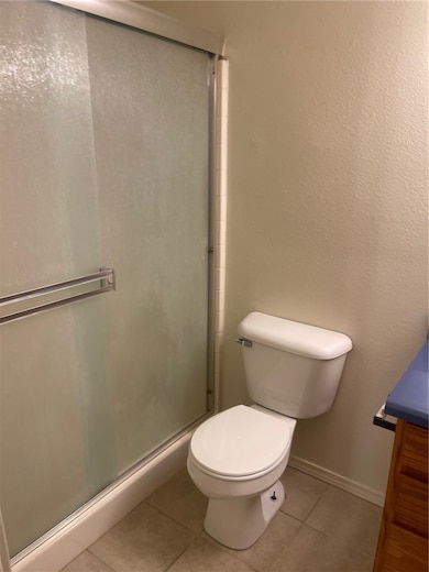 Bathroom featuring vanity, tile patterned floors,