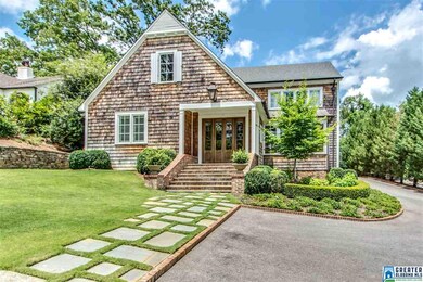 Exterior with Spanish Cedarwood French doors.