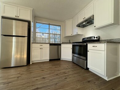 Updated kitchen with stainless steel appliances an