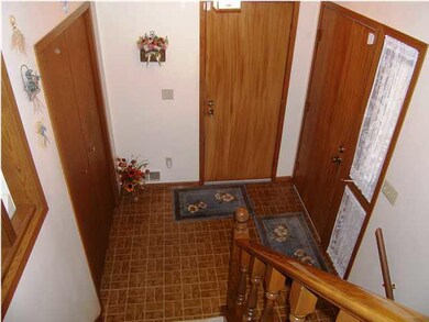 The entry foyer features a large double coat close