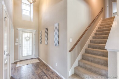  This entry way is stunning. Handscraped Hardwood