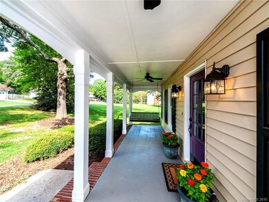 Large front porch with ceiling fans & swing perfec