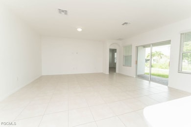 Empty room featuring arched walkways