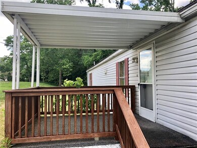Covered front porch to entrance.