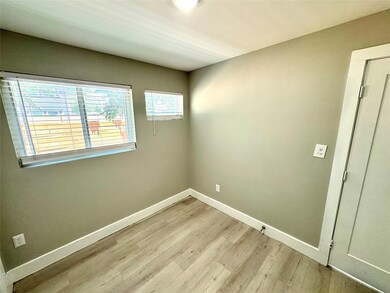 Spare room featuring light hardwood / wood-style f