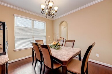 Dining room with warm hardwood floors added for elegance.