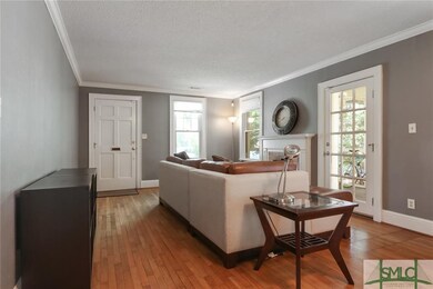 Living room features include original hardwood flo