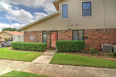 View of front of house with central AC unit and a 