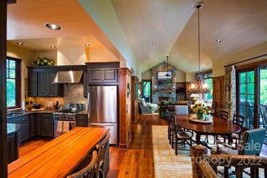 Open floor plan is well finished with wood walls, 
