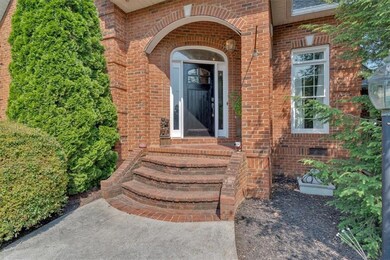 View of exterior entry with brick siding