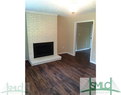 Living Room. Living Room Leads into Kitchen and Fa