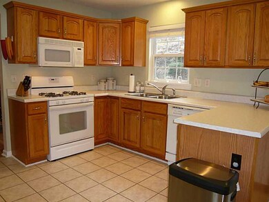 Cafeteria/Kitchen. Gas Range, Built-in Microwave Oven, Disposal, Dishwasher and Refrigerator!  Seperate pantry too!