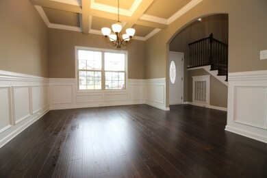 EXAMPLE>>>BEAUTIFUL Formal Dining Room with Wood Flooring, Custom Trim and Coffered Ceiling!