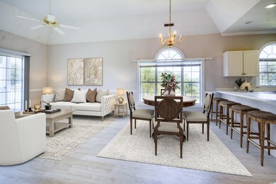 Dining area featuring vaulted ceiling, ceiling fan