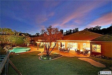 The backyard is flat and usable with a custom desi