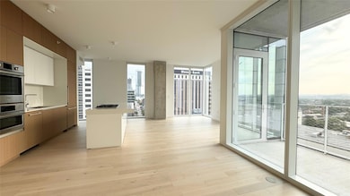 Kitchen featuring a wall of windows, healthy amou
