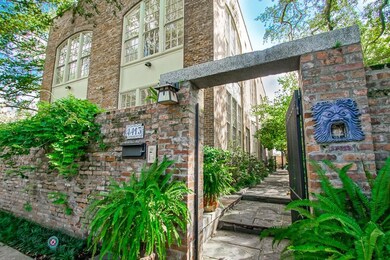 WALKWAY WITH LUSH GARDENS TO THE CONDO'S ENTRANCE.