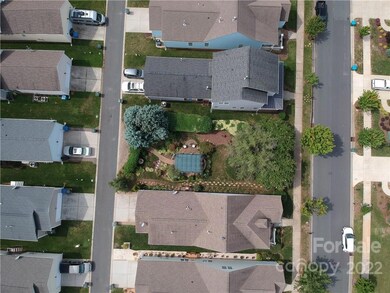 The green square shape structure in the middle of the lot is a pergola that would need to be removed.