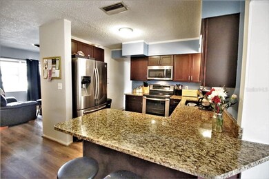 Remodeled kitchen with granite countertops and sta