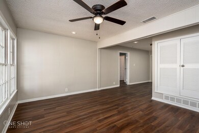 Spare room with dark hardwood / wood-style floorin