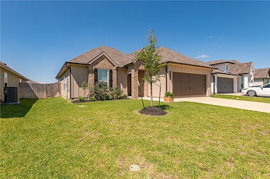 Single story home with a garage, driveway, central