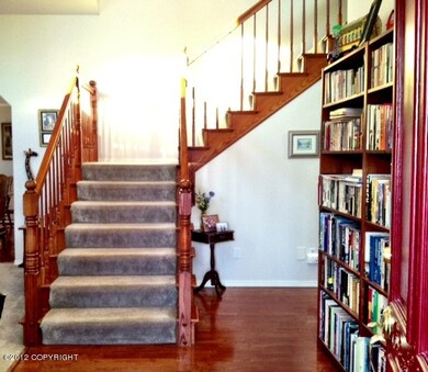 Vaulted Entry with hardwood floors