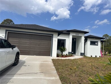 Prairie-style house featuring concrete driveway, a
