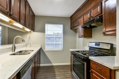 Kitchen has quartz counters and dishwasher
