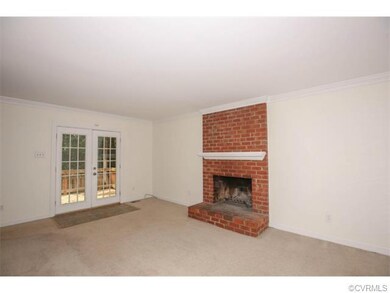 View of living area towards 16x10 deck, wood burni