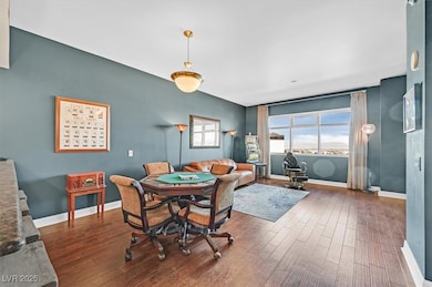 Dining space featuring baseboards and dark wood-st