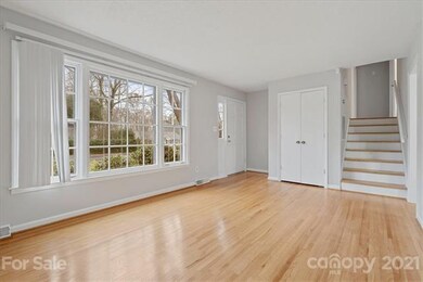 Living Room with Upstairs Staircase