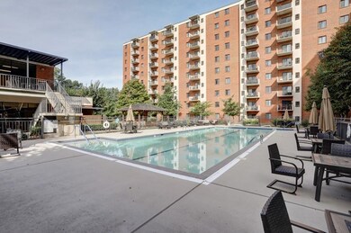 Community pool featuring a patio