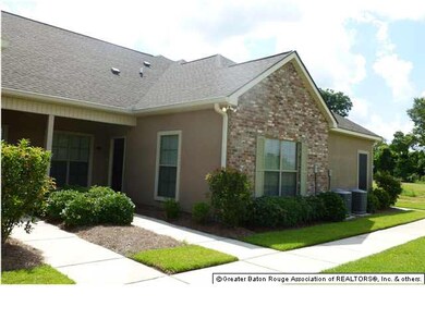 The back of the home provides a remote door garage