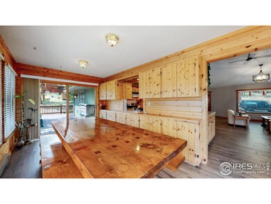 Large dining room with windows all around and lots of storage.