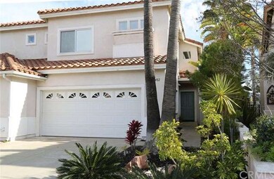 Front of home showing 2 car garage with roll up do